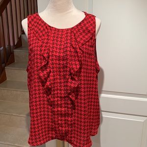ELLE. Red and black sleeveless top, with ruffles in front. Geometric pat…